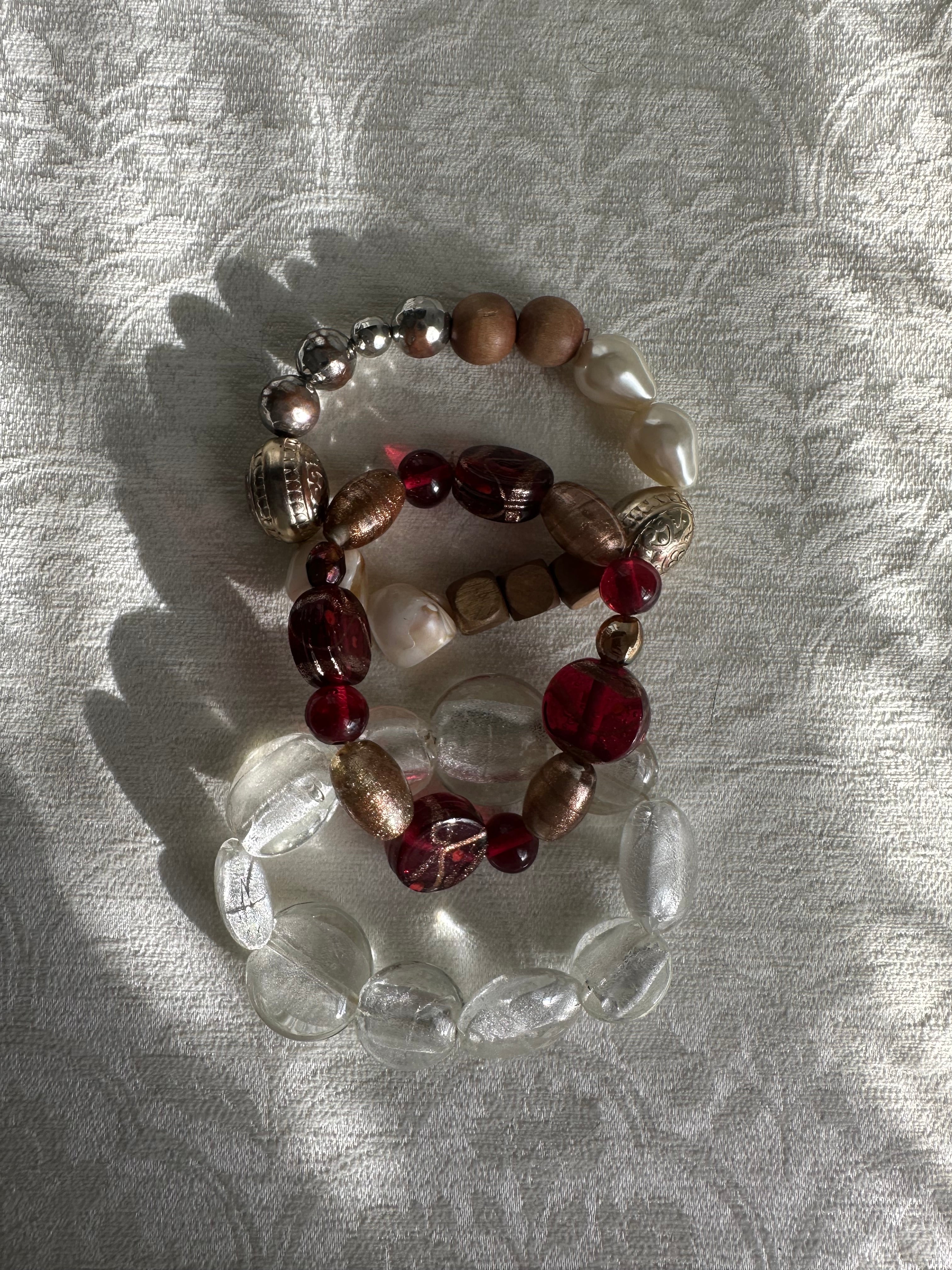 3 stacks of bracelets