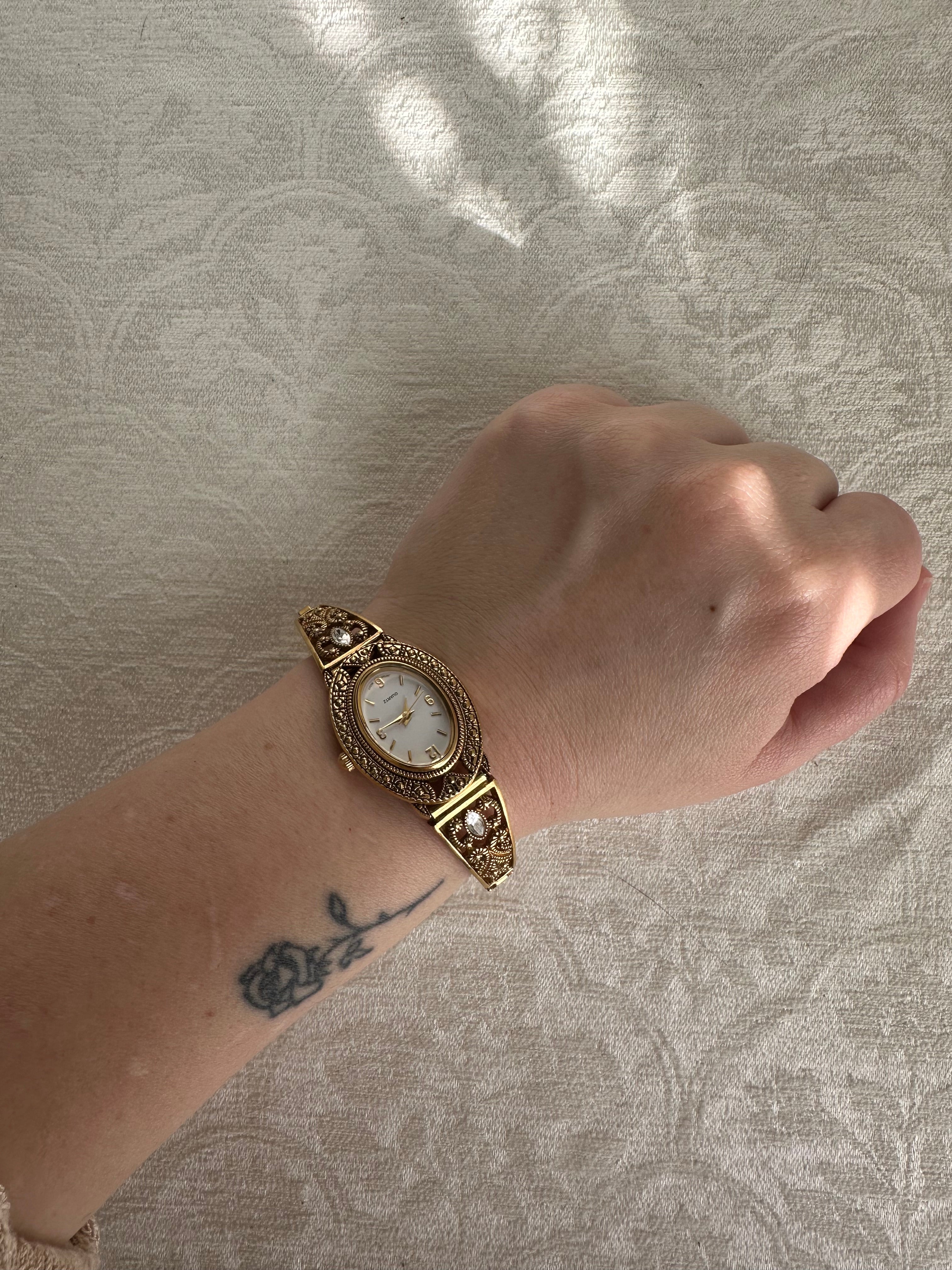 Victorian-Inspired Gold Filigree Bangle Watch with Mother of Pearl Face
